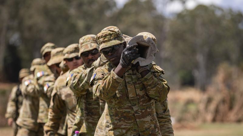 Australian Army soldiers from the 51st Battalion, Far North Queensland Regiment assist the public by clearing flood-damaged hazards from Colleges Crossing Recreation Reserve, Ipswich as part of Operation Flood Assist 2022. Photo: Corporal Nicole Dorrett