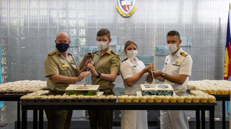 ADFA Deputy Commandant Colonel James Murray, left, Officer Cadet Liam Brady; Midshipman Victoria Kuntz and ADFA Director of Education and  Training Captain James Hawley, cut cakes to mark Army and Navy's birthdays. Photo: Officer Cadet Elliot Parker