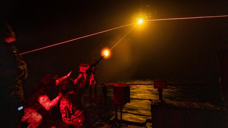 Boatswain’s mates from HMAS Arunta conduct training on a 12.7mm machine gun using a flare target during their regional presence deployment. Photo: Leading Seaman Sittichai Sakonpoonpol