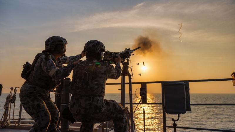 Boatswain’s mates from HMAS Arunta conduct a 12.7mm machine gun live-fire serial during Exercise Milan 2022. Photo: Leading Seaman Sittichai Sakonpoonpol