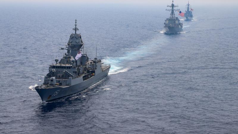 HMAS Arunta, left, sails in company with US Navy destroyer USS Momsen and Japan Maritime Self-Defense Force destroyer JS Yūdachi. Photo: US Navy Aicrewman Regnor Vondedenroth
