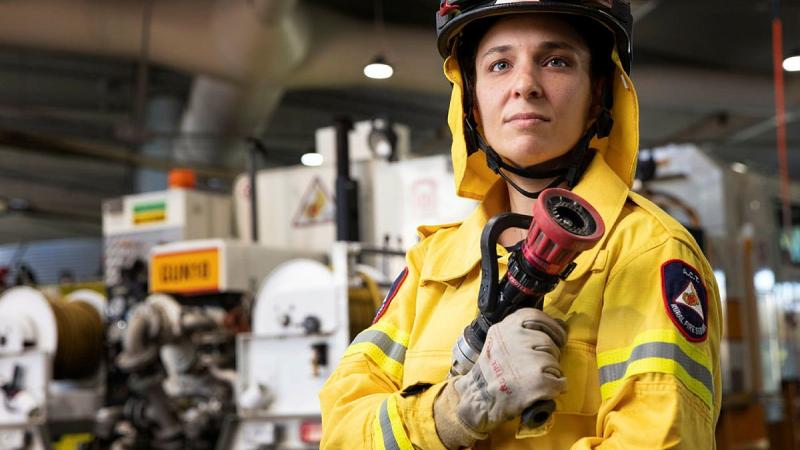 Navy marine engineering officer Lieutenant Loretta Binder is a volunteer firefighter at the Gungahlin brigade of the ACT Rural Fire Service in Canberra. Photo: Petty Officer Bradley Darvill