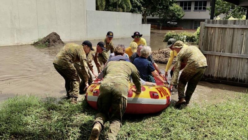Soldiers from 5RAR assist residents of aged-care facilities evacuate during Operation Flood Assist 2022 in Brisbane.