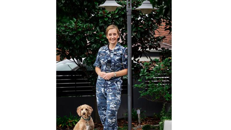 Squadron Leader Louise Burr, pictured with her dog Eddie, was announced as the 2021 Australian Defence Magazine Women in Defence Award winner for engineering. Photo: Corporal Melina Young