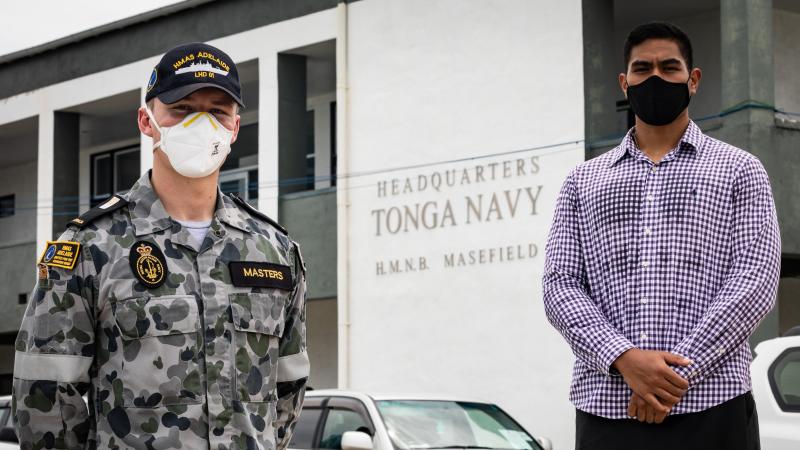  Midshipman Callum Masters, left, with Midshipman Paula Ulakai at their reunion in Tonga. Photo: Leading Seaman David Cox