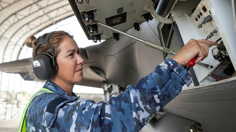 Sergeant Brooke Saunders performs a check of an F-35A Lightning II during Exercise Cope North 2022 at Andersen Air Force Base, Guam. Photo: Leading Aircraftman Sam Price