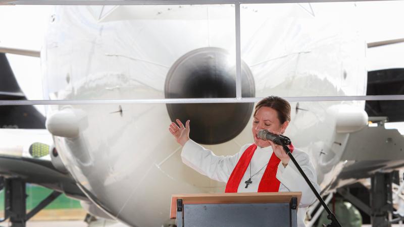 Chaplain Squadron Leader Sue Page conducts the prayer of dedication during the unveiling of the P-8A Poseidon at its new home at RAAF Base Edinburgh. Photo: Corporal Craig Barrett