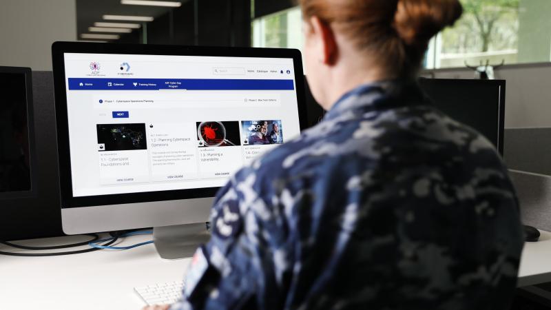 Royal Australian Air Force officer Squadron Leader Kylie Breheny conducts user acceptance testing with the Australian Defence Force Cyber Gap Program’s new partner Cybermerc in Canberra. Photo: Jay Cronan