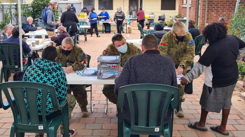 From left: Private Tori Doherty, Lieutenant Joshua Mildrum and Captain Michele Muncaster, from the 3rd Health Battalion, provide administrative support during the pop-up clinic at Stepping Stones in Port Augusta, South Australia.