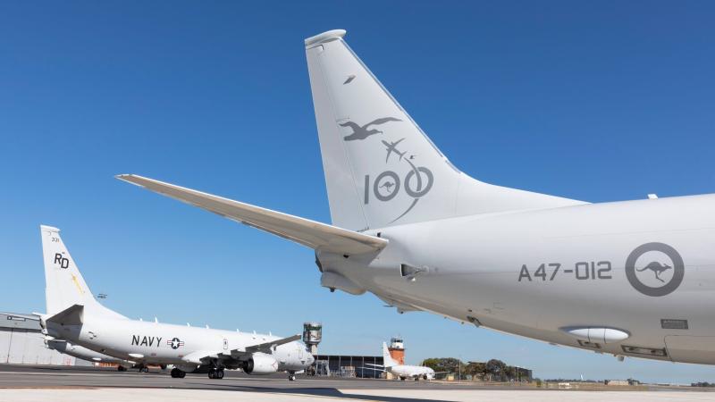 A United States Navy P-8A Poseidon taxis past a Royal Australian Air Force P-8A Poseidon on the No. 92 Wing flightline at RAAF Base Edinburgh in South Australia. Photo: Leading Aircraftman Stewart Gould