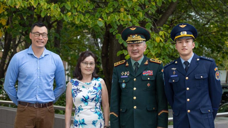 Interpreter Flight Lieutenant Burentogtokh Altantseteg, left, with Mongolian Air Force officer Major General Enkhbayar Ochir, centre right, his wife, Mrs Uranchimeg Yadamdorj, and Lieutenant Tsolmonbaatar Badral. Photo: Leading Aircraftman Sam Price