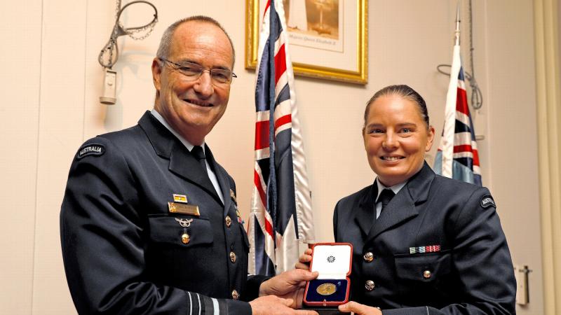 Chief of Air Force, Air Marshal Mel Hupfeld awards Pilot Officer Nicola Mitchell with Her Majesty The Queen's Gold Medal as outstanding officer trainee at an awards function at RAAF Base Base Point Cook, Melbourne. Photo: Corporal Kieren Whiteley