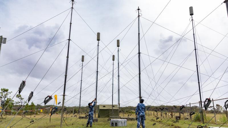 Corporal Chathuri Rogers and Leading Aircraftwoman Mary-Anne Bryce from No. 3 Control and Reporting Unit check the AN/TPS-77 Tactical Air Defence Radar System antennas at Old Bar airfield, north of Newcastle, during Exercise Diamond Shield
