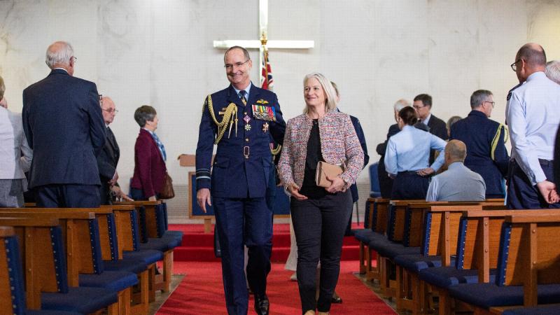 Chief of Air Force Air Marshal Mel Hupfeld and his wife, Louise Hupfeld, depart the Chapel of the Holy Trinity at RAAF Base Point Cook, Melbourne, after the reopening. Photo: Leading Aircraftman Sam Price
