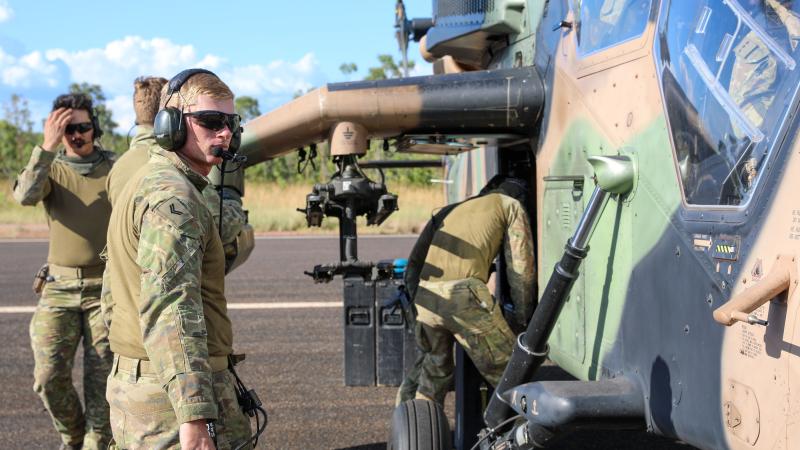 Corporal Callum Hite supervises the preparation of a Tiger armed reconnaissance helicopter for live-fire practise during Exercise Griffin Guns at Mount Bundey training area, south of Darwin. Photo: Lance Corporal Mitchell Creek