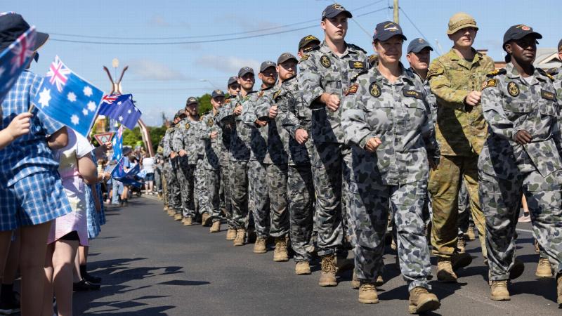 Royal Australian Navy sailors and Australian Army soldiers march down Casino's main street to the applause of locals. Photo: Corporal Jonathan Goedhart