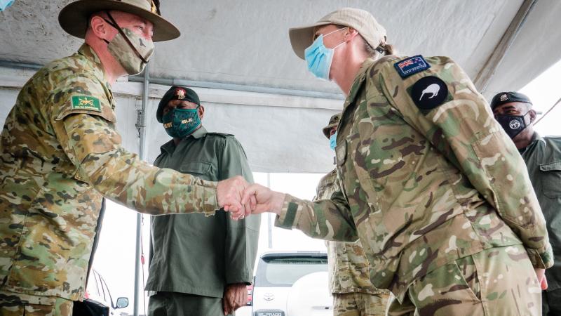 Commander of the Australian Deployable Joint Force Headquarters, Major General Scott Winter, left, meets with New Zealand Army soldier Warrant Officer Class Two Sarah Rutene from the Solomons International Assistance Force in Honiara, Solomon Islands.