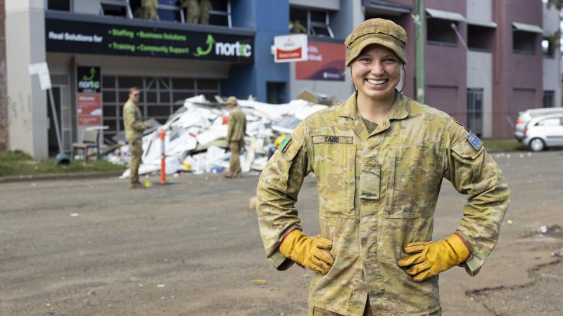 Private Jaimi Tabb from 1st Combat Service Support Battalion takes a quick breather while helping to clear flood-damaged office furniture from the Red Cross Lifeblood Donor Centre in Lismore, during Operation Flood Assist. 
