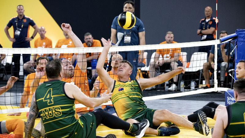 Australian Invictus Games 2020 competitor Mark Armstrong deflects the ball during the sitting volleyball match against Netherlands at Invictus Games Park in The Hague, Netherlands. Photo: Flight Sergeant Ricky Fuller