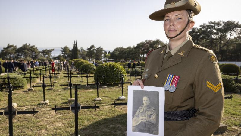 Australian Army Band musician Corporal Laura Burden holds a photo of her great-uncle, Private Richard Bainbridge Brooker who served at Gallipoli in 1915. Photo: Corporal David Cotton