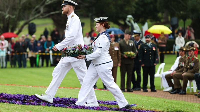 Lieutenant Commander Blake Newman and Able Seaman Mikayla Cocks lay a wreath at Mother’s Memorial, Toowoomba, on behalf of HMAS Toowoomba at the Anzac Day wreath-laying ceremony. Photo: Bradley Richardson