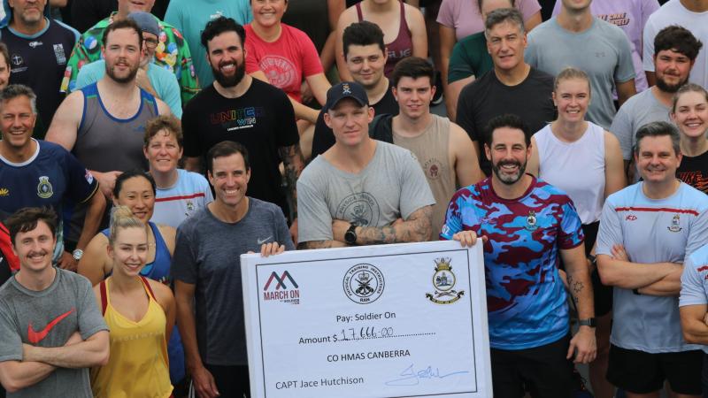 The ship's company of HMAS Canberra shortly after completing the 96km March On challenge raising funds for Soldier On.