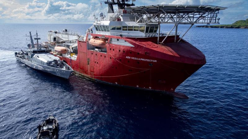 HMAS Ararat rafted alongside ADV Ocean Protector for refuelling at Christmas Island.