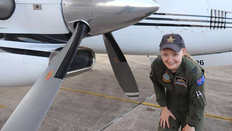 RAAF No. 32 Squadron pilot Flying Officer Wynona Winslett conducts her inspection aircraft walk-around ahead of a KA350 King Air flight during Exercise Bersama Shield 2022.