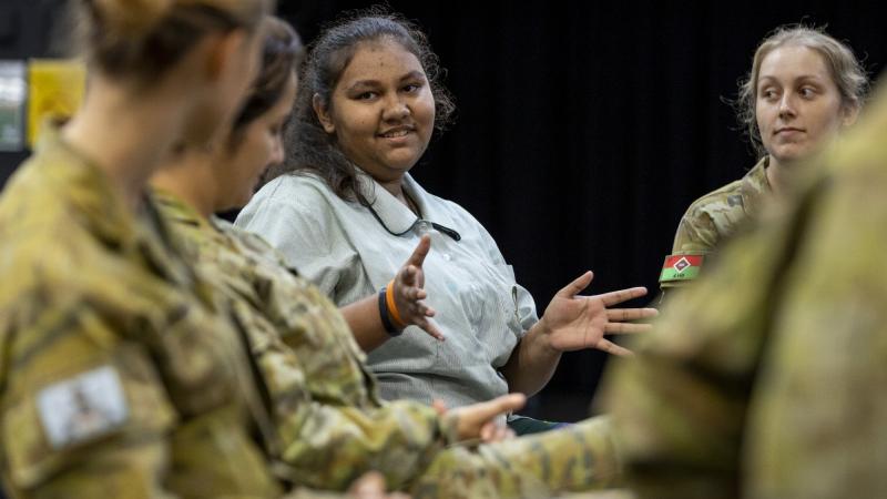 A student from Thuringowa State High School speaks to personnel from 3rd Brigade during a mentoring program. Photo: Corporal Brodie Cross