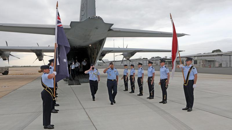 Chief of Staff, Indonesian Air Force, Air Chief Marshal Fadjar Prasetyo (centre), accompanied by Air Force Attache - Jakarta Group Captain Ken Bowes, is welcomed to RAAF Base East Sale with a guard of honour. Photo: Petty Officer Richard Prideax