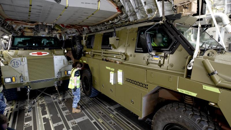 Converted Bushmaster protected mobility vehicles bound for Ukraine are loaded onto a C-17A Globemaster III aircraft at RAAF Base Amberley, Queensland. Photo: Leading Aircraftwoman Kate Czerny