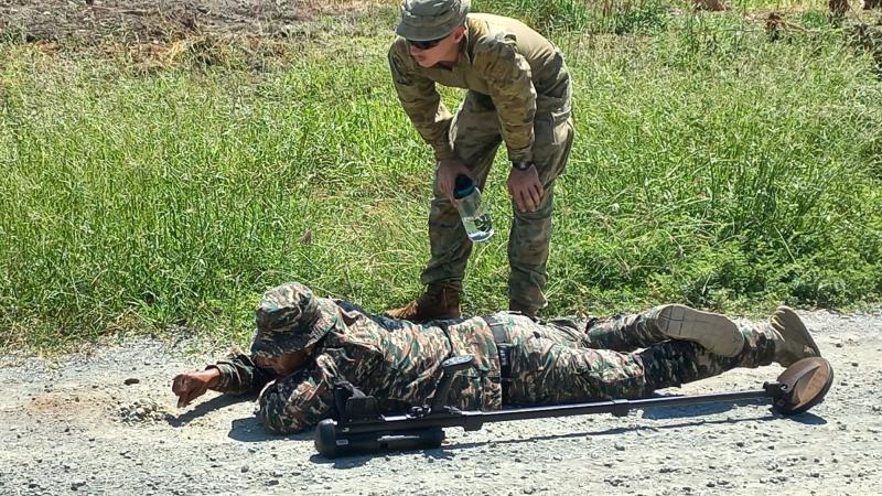 Lance Corporal Bailey Young and a soldier from the Timor-Leste Defence Force during mine patrolling and detecting training in Timor-Leste as part of the Defence Cooperation Program.