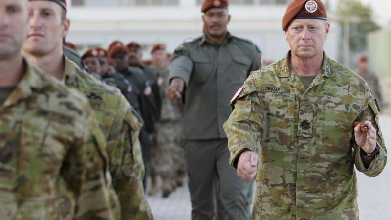 Warrant Officer Class One Mick Dewar takes part in the 40th anniversary parade at South Camp in Sharm el-Sheikh, Egypt. Photo: Petty Officer Lee-Anne Cooper
