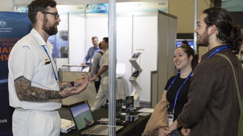 Petty Officer Electronics Technician Submarines Michael Budden works at the Defence Force Recruiting stand during the Royal Australian Navy Sea Power Conference as part of Indo Pacific 2022 held in Sydney.