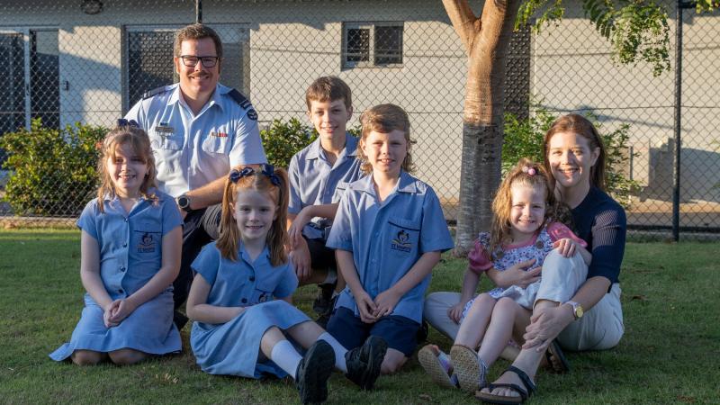 Air Force Flying Officer Scott Wilson and his wife Sarah with their five children in Darwin.