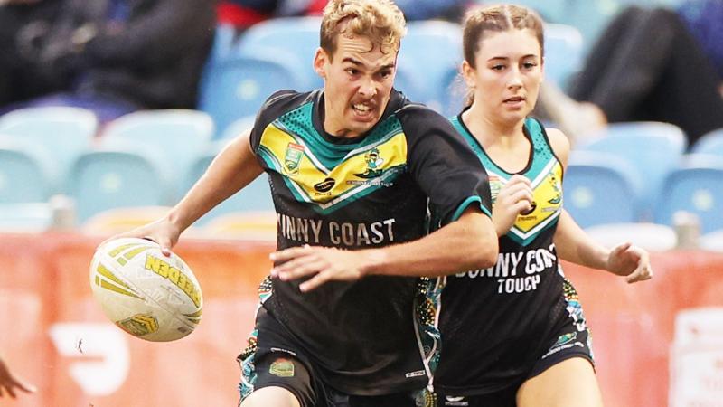 Private Drew Price, from 1st Battalion, Royal Australian Regiment, in full flight during the National Touch League mixed open grand final victory for Sunshine Coast.