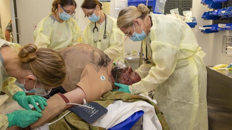 Nursing officers conduct a collective training simulation activity at HMAS Penguin in Sydney. Photo: Leading Seaman Matthew Lyall