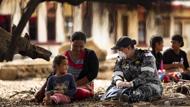 Lieutenant Commander Makaila Lasalo, right, talks with Nomuka Island residents during Operation Tonga Assist 2022. Photo: Leading Seaman Daniel Goodman
