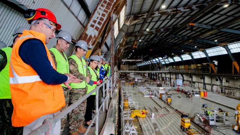 Tim Burnell, Chief Executive Officer of INCAT takes members of the Service Attachés and Advisory Group through the company's ship building facility in Hobart. Photo: Corporal Robert Whitmore
