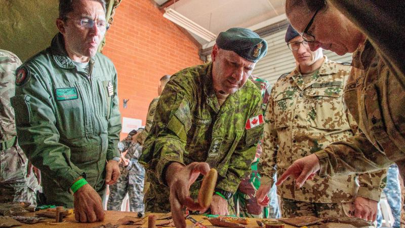 (L-R) Italian Air Force Defence Attaché Colonel Salvatore Trincone, Canadian Defence Attaché Colonel Richard Raymond, and German Deputy Defence Attaché Lieutenant Colonel (GS) Dominic Vogel, try food at HMAS Stirling. Photo: Corporal Robert Whitmore