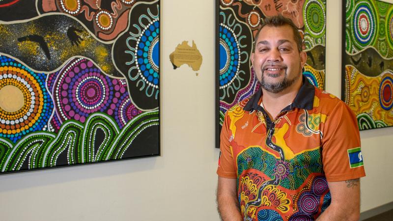Nyoongar Artist Kevin Bynder with his artwork. Photo: Sergeant Gary Dixon