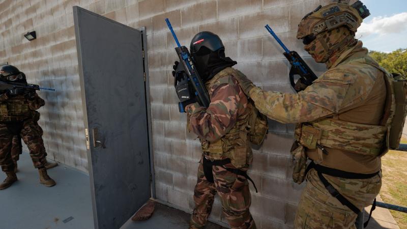 Australian Army soldiers from 1 RAR train with Royal Tongan Marines on urban clearance drills at Lavarack Barracks. Photo: Sergeant Andrew Sleeman
