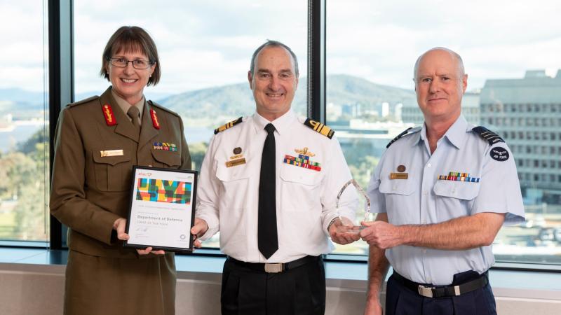 Vice Chief of the Defence Force Vice Admiral David Johnston, centre, presents award to Major General Kathryn Toohey, left, and Deputy Director Defence Lessons Wing Commander Alan Hunter. Photo: Jay Cronan