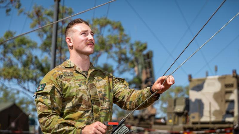 Aircraftman Samuel Forsberg from No. 3 Control and Reporting Unit, checks the AN/TPS-77 Tactical Air Defence Radar System antennas at Timber Creek during Exercise Diamond Storm 2022. Photo: Leading Aircraftman Samuel Miiller