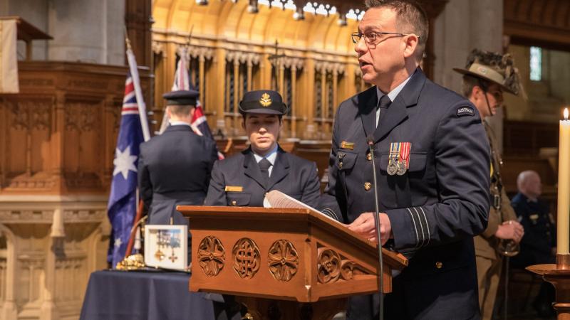 Royal Australian Air Force Officer Wing Commander Andrew Harrigan speaks to guests during the Sir Ross Smith commemorative service held at St Peter's Cathedral in Adelaide. Photo: Sergeant Murray Staff