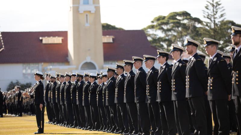 Members of New Entry Officers' Course 66 stand at attention during their graduation ceremony at HMAS Creswell. Photo: Leading Seaman Ryan Tascas