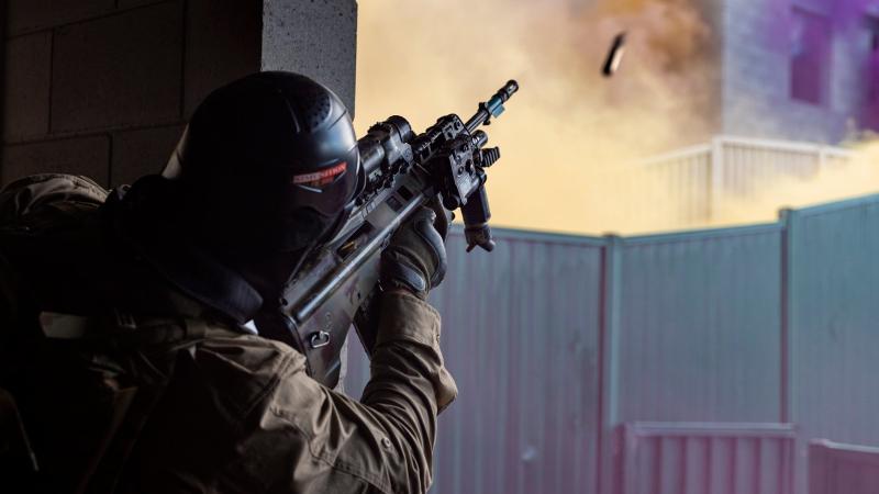 A rifleman from Alpha Company, 8th/9th Battalion, Royal Australian Regiment, fires an F88 Austeyr rifle during urban operations training held as part of Exercise Ram Horn at the Wide Bay training area. Photo: Corporal Nicole Dorrett