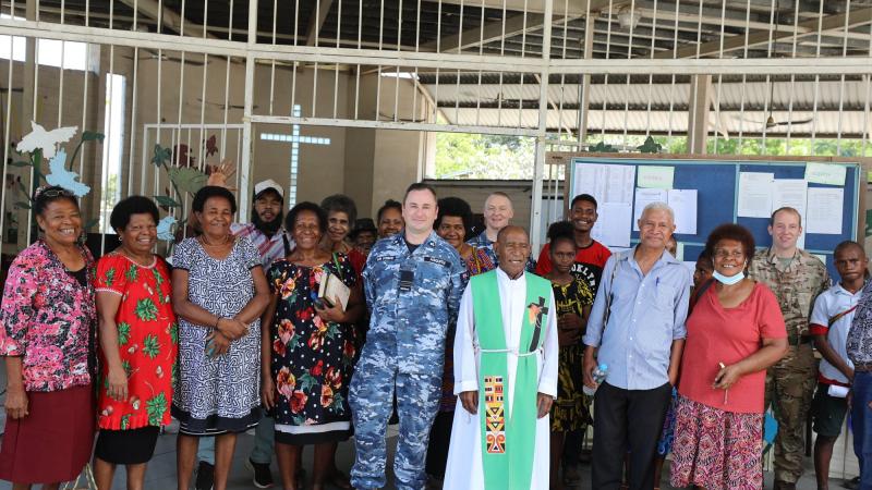 Chaplain Stuart Asquith (centre) and ADF members on Operation Kimba join Parish Priest Father Philip Jiregari and parishioners at a Sunday service at Saint Martin's Anglican Church, East Boroko Papua New Guinea. Photo: Major Martin Hadley