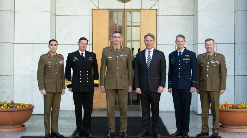 Major General Simon Stuart, left, Rear Admiral Mark Hammond, Chief of the Defence Force General Angus Campbell, Deputy Prime Minister Richard Marles, Air Vice-Marshal Robert Chipman, and Lieutenant General Greg Bilton. Photo: Kym Smith 