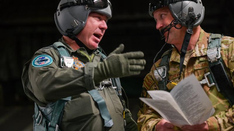 Royal Australian Air Force Flight Sergeant Ben Russell, left, speaks with US Air Force Technical Sergeant Eric Wiershcem at Joint Base Pearl Harbor-Hickam, Hawaii. Photo: Staff Sergeant Alan Ricker (USAF)